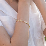 Pulseira temática banhada a ouro com infinitos