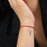 Pulseira coração banhada a ouro com cristais vermelhos