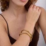 Pulseira rígida grande em aço inoxidável dourado