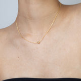 Colar banhado a ouro com pendente esfera