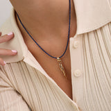 Colar de pedra peixes banhados a ouro com cristais