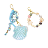 Porta-chaves dourado concha com missangas e pendentes